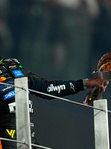 McLaren driver Lando Norris of Britain celebrates after becoming a world champion after the Formula One Abu Dhabi Grand Prix at the Yas Marina Circuit in Abu Dhabi, UAE, Sunday, Dec. 7, 2025.