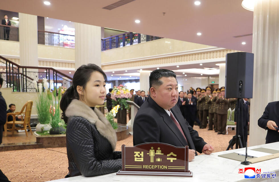 North Korean leader Kim Jong Un (R) and his daughter Ju Ae (L) inspecting the Milyong Hotel