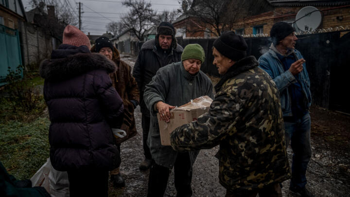 Locals receive humanitarian aid in Bakhmut, Donetsk region on December 8, 2022.