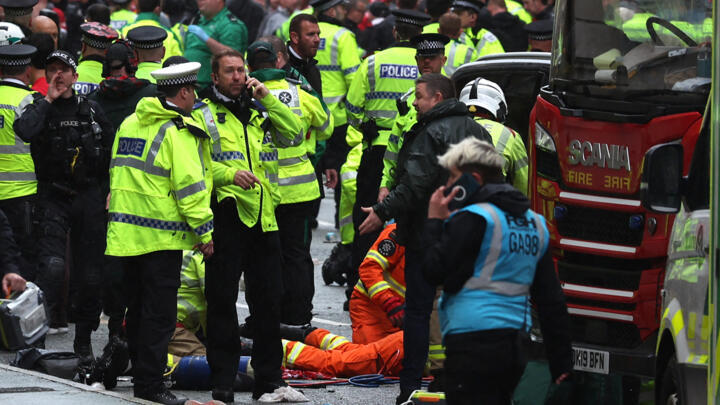 Emergency services treat members of the public on the sidelines of an open-top bus victory parade for Liverpool's Premier League title win, in Liverpool, north-west England on May 26, 2025.