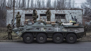 Ukrainian soldiers stand on an armored personnel carrier before going to the frontline in Donetsk region, Ukraine, on January 28, 2023.