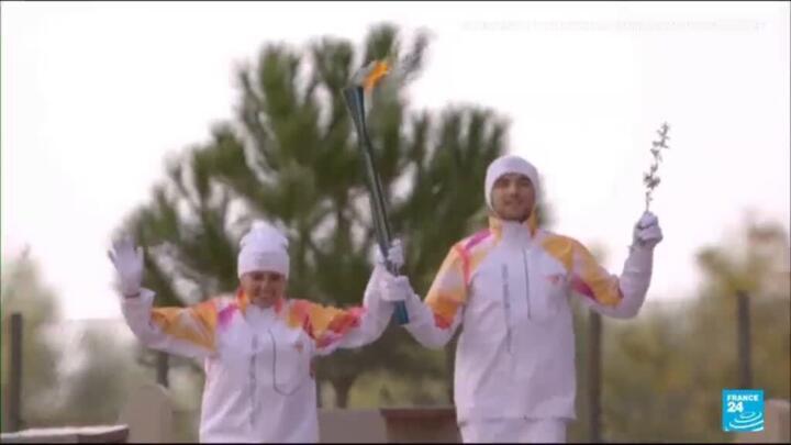 Olympic flame begins its weather-hit journey to Milan-Cortina 2026