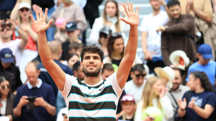 Carlos Alcaraz celebrates his first win at this year's French Open in Paris.