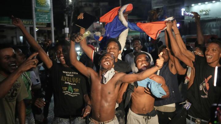 Fans celebrate Haiti's qualification for the 2026 FIFA World Cup after a soccer match against Nicaragua, in Port-au-Prince, Haiti, Tuesday, Nov. 18, 2025. 