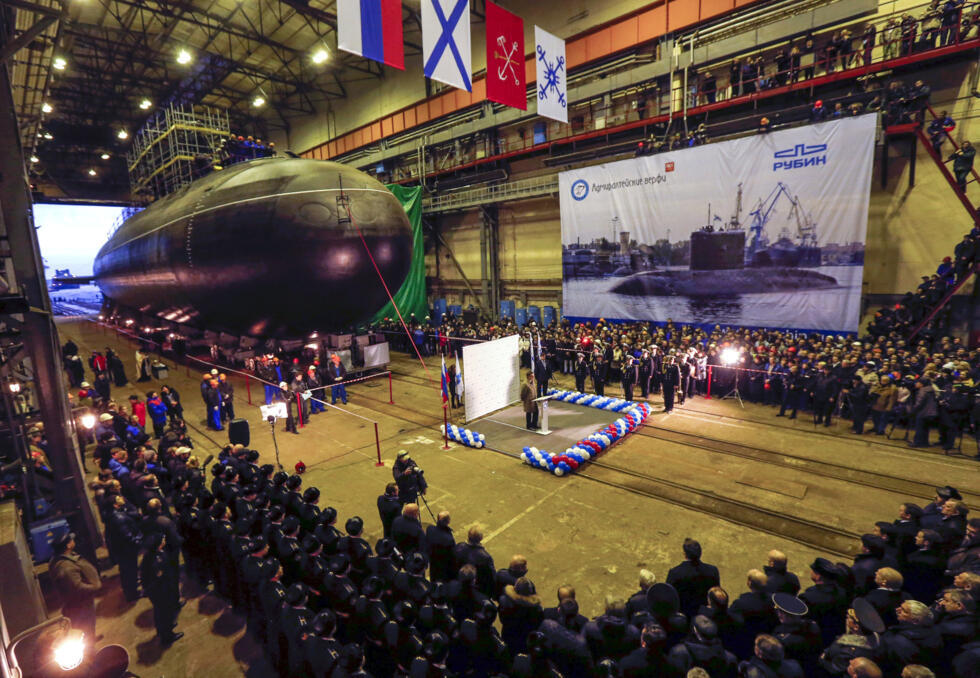 Sailors line up during a ceremony launching the Novorossiysk, a diesel-electric submarine, at the Admiralteiiskiye Shipyard in Saint Petersburg, on November 28, 2013.