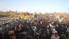 Tunisian policemen clash with residents of the city of Gabes on October 15, 2025.