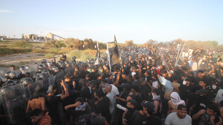 Tunisian policemen clash with residents of the city of Gabes on October 15, 2025.