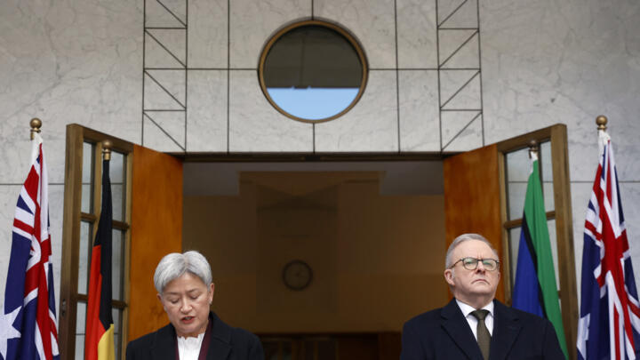 Australia's Foreign Minister Penny Wong (L) speaks next to Australia's Prime Minister Anthony Albanese during a press conference in Canberra on August 11, 2025.