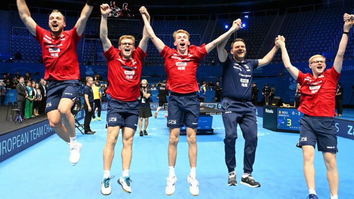 French table tennis players celebrate winning the team title in the final of the European Championships against Romania, On Sunday, October 19, 2025.