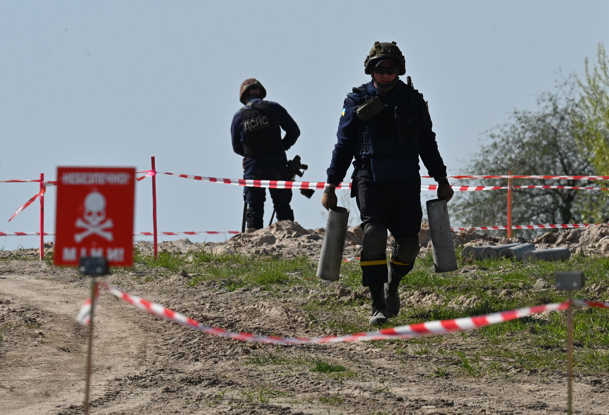 Ukrainian deminers at work at an airport in the town of Hostomel, northwest of Kyiv