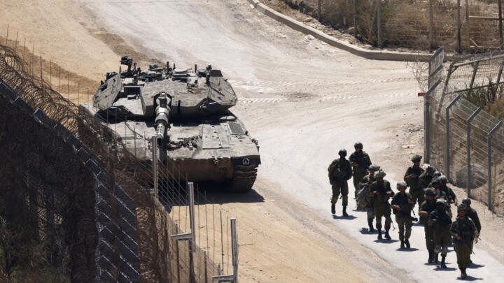 Israeli troops patrol the border fence with Syria near the Druze village of Majdal Shams in the Israel-annexed Golan Heights on July 23, 2025.