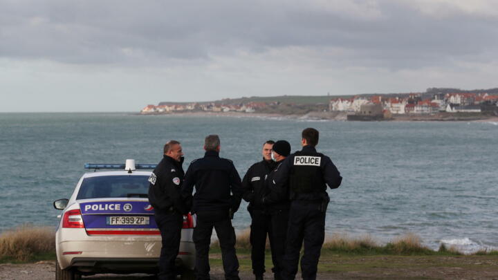 This file photo shows French police patrolling the Slack dunes the day after 27 migrants died in an attempt to cross the English Channel, in Wimereux, near Calais, November 25, 2021.