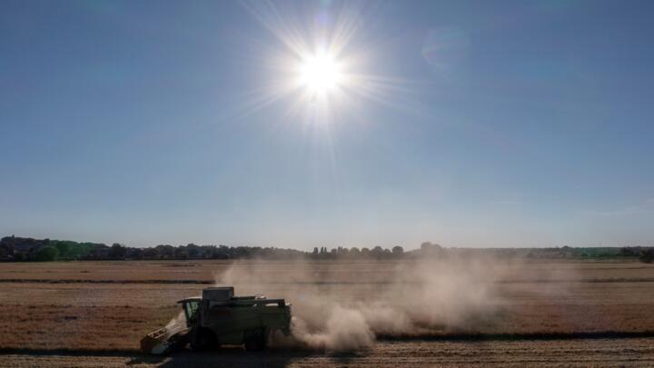 A combine harvester at work in Lincolnshire, eastern England, as Britain suffers its driest spring in over a century.
