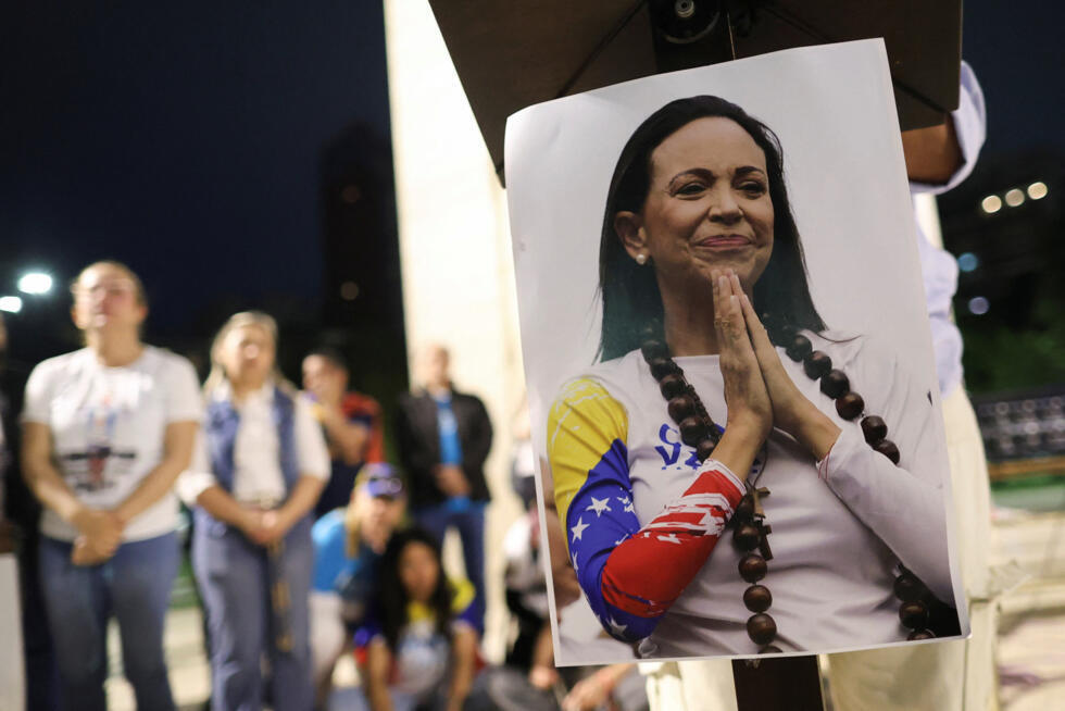 A photo of Maria Corina Machado is displayed as Venezuelans residing in Argentina celebrate after Venezuelan opposition leader Maria Corina Machado was awarded the Nobel Peace Prize 2025.