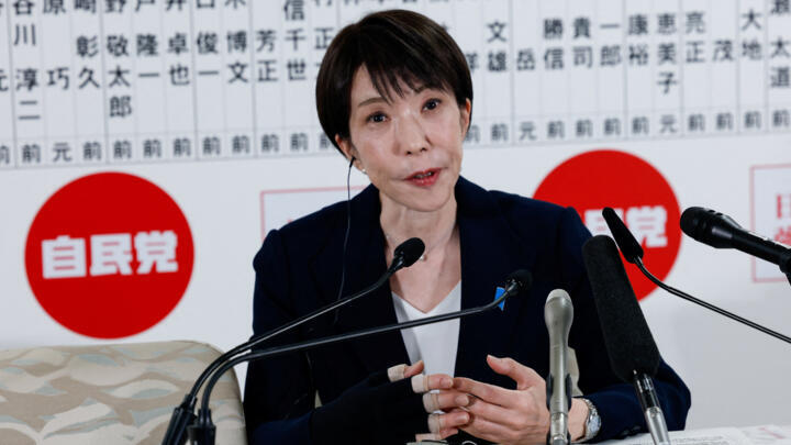 Japan's Prime Minister Sanae Takaichi, leader of the ruling Liberal Democratic Party (LDP), who has previously suffered a hand injury, speaks to the media in front of a board displaying the names of LDP candidates at the LDP headquarters on general election day in Tokyo, Japan, February 8, 2026. REUTERS/Kim Kyung-Hoon/Pool