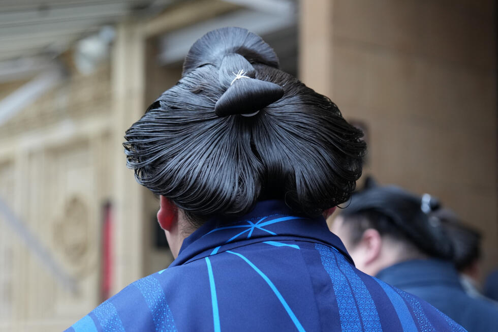 Rikishi (sumo wrestlers) arrive at the Royal Albert Hall in London ahead of the Grand Sumo Tournament