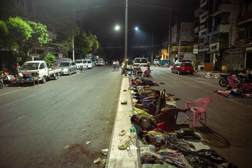 People sleep on the street in Mandalay after the deadly earthquake