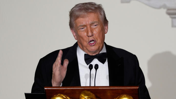 President Donald Trump speaks to guests in the Grand Foyer of the White House during the Congressional Ball, Thursday, Dec. 11, 2025, in Washington.