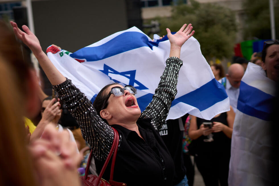 A woman shouts with joy after the announcement of the agreement between Israel and Hamas, in Tel Aviv, Israel, on October 9, 2025.