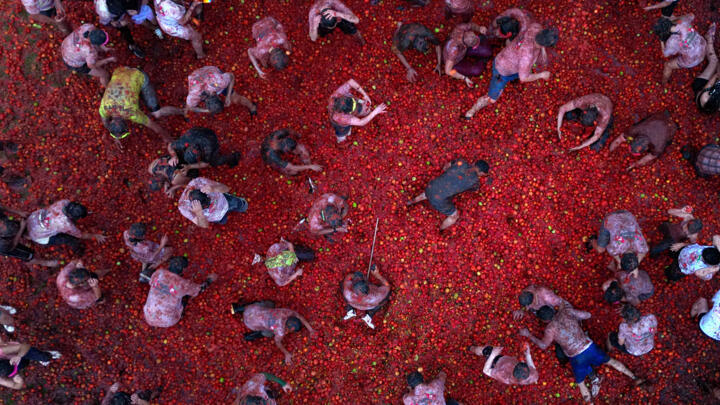 Aerial view of people participating in the fifteenth annual Tomato Fight Festival known as "Tomatina" in Sutamarchan, Colombia, on June 1, 2025.
