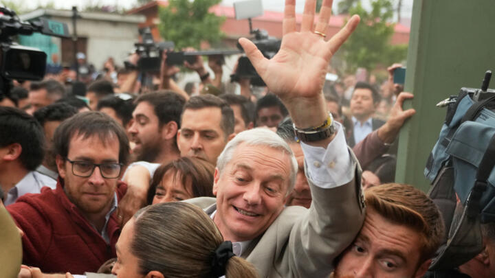 Jose Antonio Kast, presidential candidate for the Republican Party, arrives to vote during the presidential runoff election in Santiago, Chile on December 14, 2025.