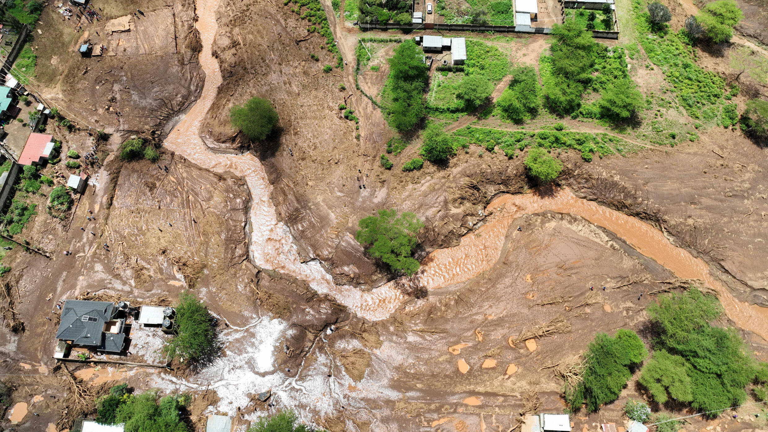 A drone image shows damaged houses after heavy flash floods wiped out several homes when a dam burst, following heavy rains in Kamuchiri village of Mai Mahiu, Nakuru County, Kenya on April 29, 2024