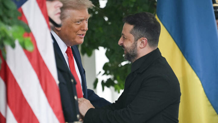 Ukrainian President Volodymyr Zelensky is greeted by US President Donald Trump upon arrival at the White House West Wing in Washington, DC, on August 18, 2025.