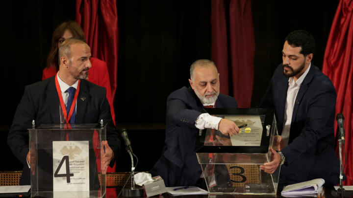 A member of electoral colleges votes to select his candidate for the new Syrian Parliament since Bashar al-Assad's government was toppled, in Damascus, Syria, October 5, 2025. 