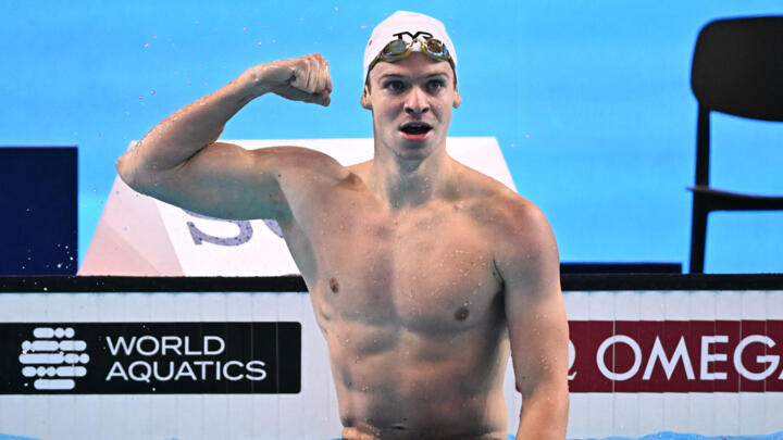 France's swimmer Léon Marchand celebrates winning a semi-final of the men's 200m individual medley swimming event and breaking the world record during the 2025 World Aquatics Championships.