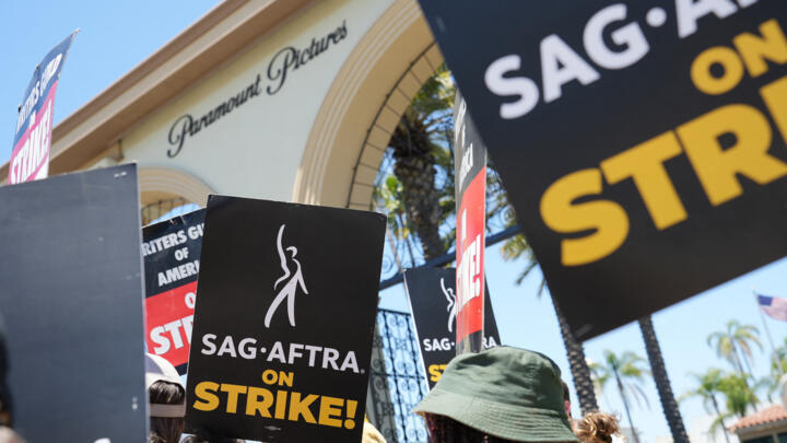 Members and supporters of SAG-AFTRA and WGA walk the picket line at Paramount Studios on July 19, 2023 in Los Angeles, California. 