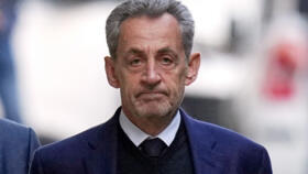Former French President Nicolas Sarkozy leaves his home in Paris on October 21, 2025 as he heads to prison.