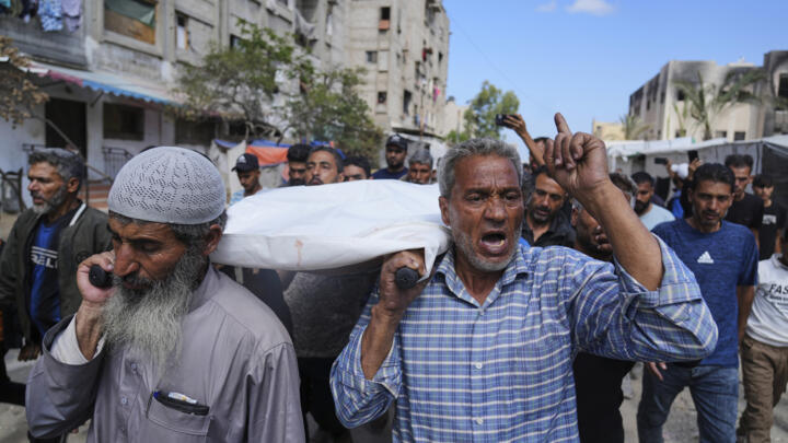 Palestinians carry Reem Al-Akhras, who was killed while heading to an aid distribution hub, during her funeral in Khan Younis, Gaza Strip on June 3, 2025.