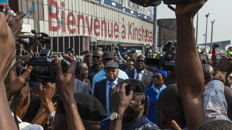 Crowds throng Kinshasa airport as opposition leader Tshisekedi returns