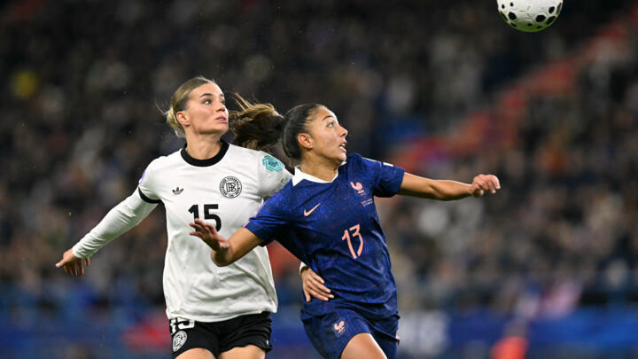 Germany's forward #15 Selina Cerci (L) and France's defender #13 Selma Bacha (R) fight for the ball during the UEFA Women's Nations League semi-final football match between France and Germany at the M