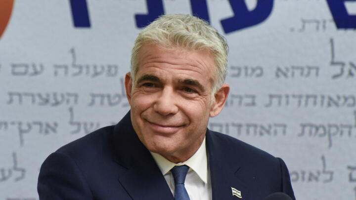 Yair Lapid, head of Israel’s centrist Yesh Atid party, delivers a statement to the press before the party faction meeting at the Knesset, Israel's parliament, in Jerusalem on May 31, 2021.