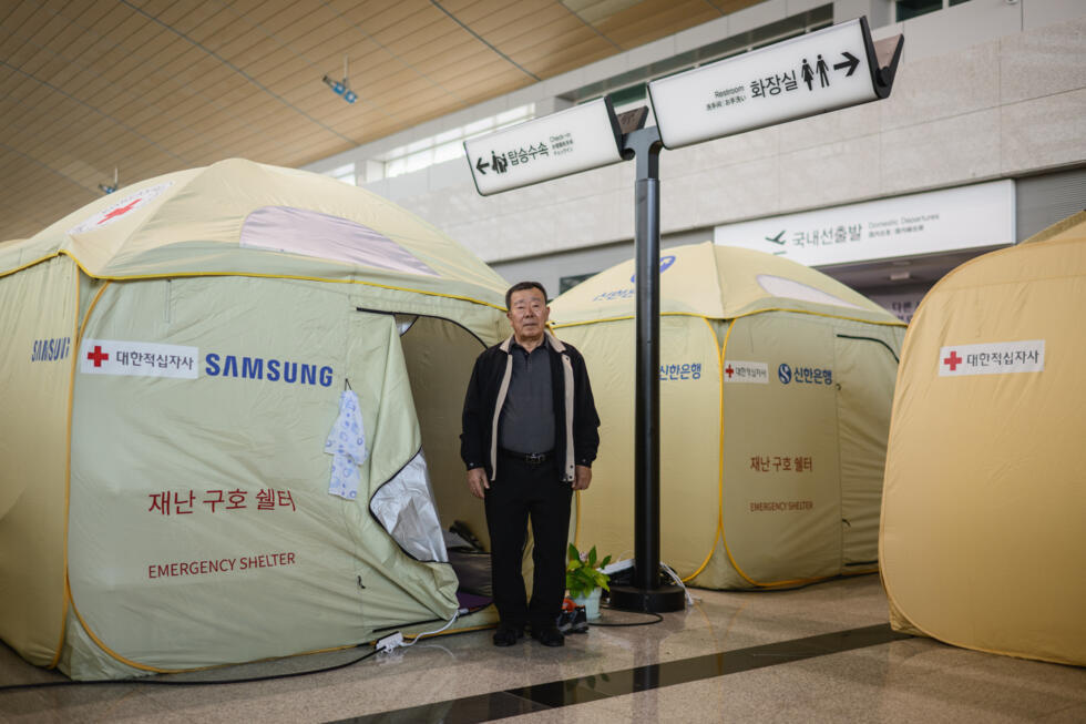 Park In-wook in front of his tent at the departures hall of Muan International Airport