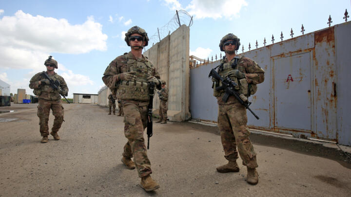 US army soldiers walk around at the K1 Air Base northwest of Kirkuk in northern Iraq before a planned US pullout on March 29, 2020. 