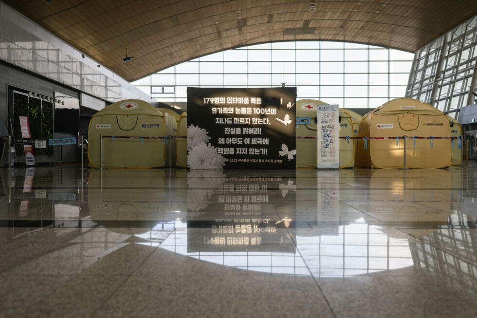 A banner put up by families of victims of the Jeju Air Flight 2216 plane crash at Muan International Airport