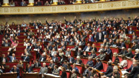 Parliament members vote at the National Assembly during a debate on social security financing bill, Wednesday, November 12, 2025 in Paris.