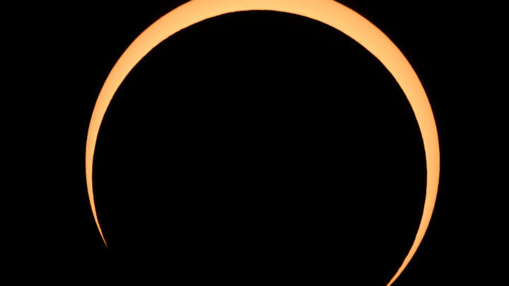 The Moon crosses in front of the Sun over Albuquerque, New Mexico, during an annular eclipse on October 14, 2023