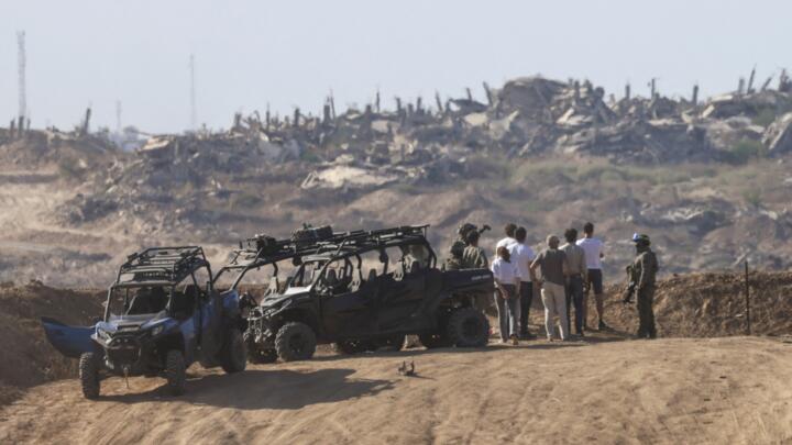 An Israeli security team standing on the border with Gaza looks at the destruction inside the Palestinian territory, on September 16, 2025.