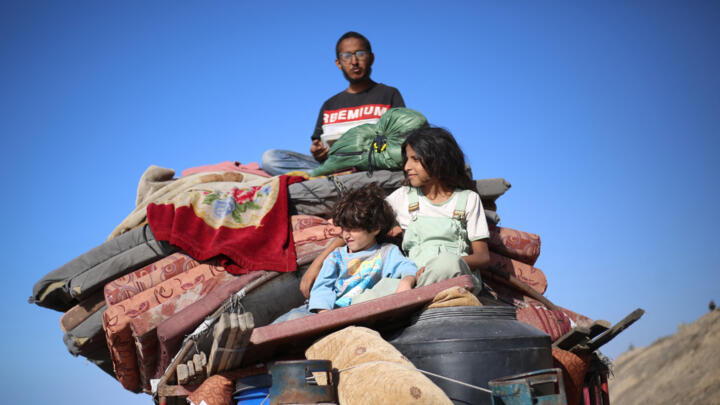 Displaced Palestinians move southwards in the central Gaza Strip on September 16, 2025.