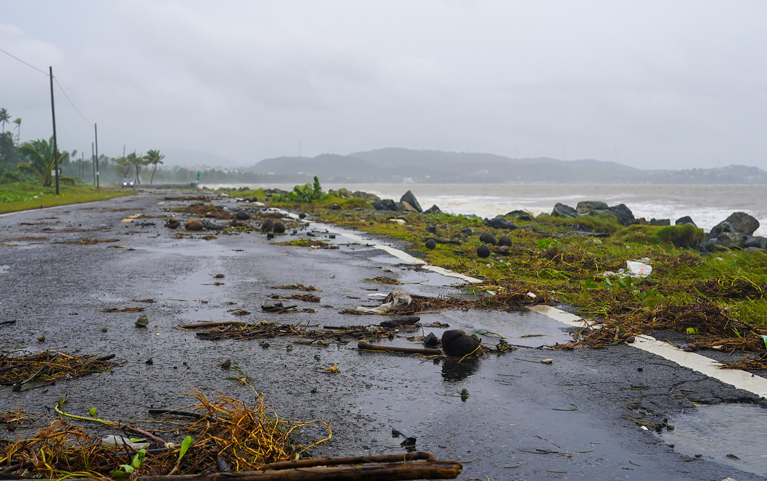 Debris litters a road on August 14, 2024 in Naguabo, Puerto Rico after Ernesto moved through