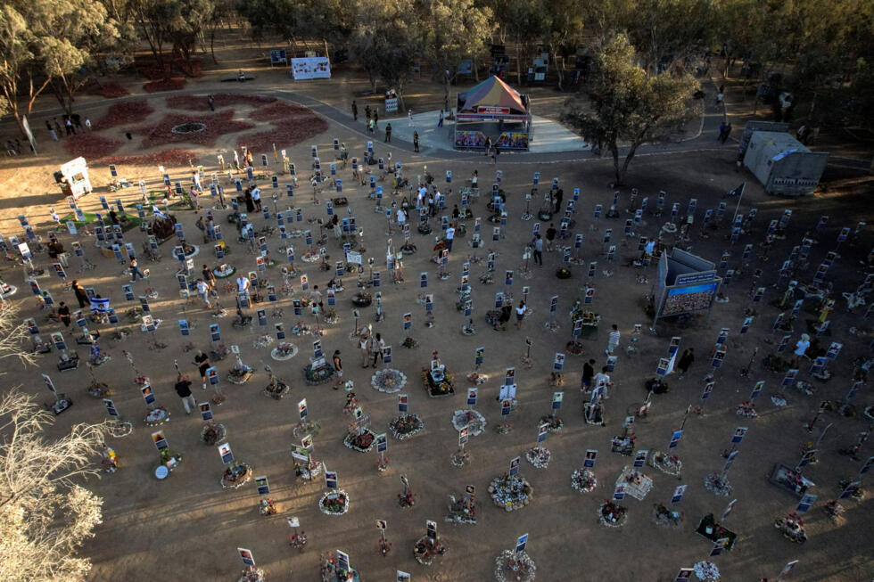 A drone view shows people visiting the site of the Nova festival, where partygoers were killed and kidnapped during the deadly October 7, 2023 attack on Israel by Hamas from Gaza.