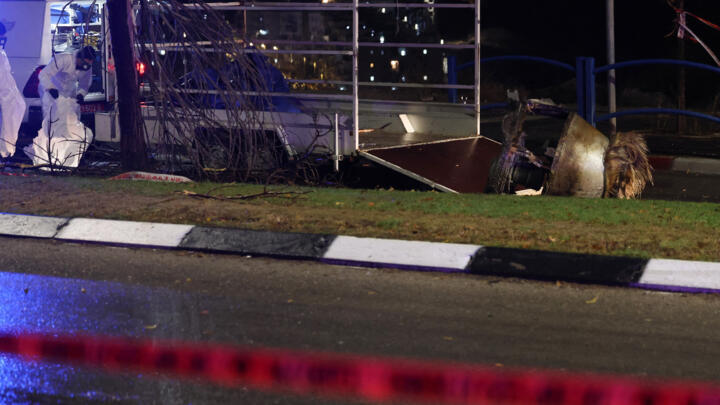 Israeli security personnel remove a fragment of a Houthi ballistic missile launched from Yemen at Israel that crashed in the central Israeli town of Bet Shemesh, near Jerusalem, on December 31, 2024.