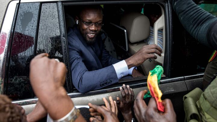 Senegal's opposition leader Ousmane Sonko waves to supporters from a car in Ziguinchor, Senegal.
