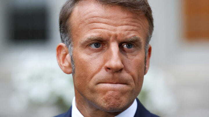 French President Emmanuel Macron looks on while speaking to the press in Washington DC on August 18, 2025.