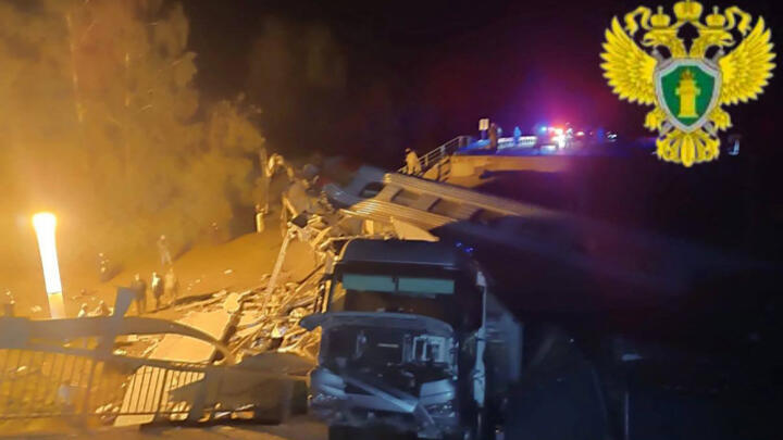 Russian officers work at the site of a bridge collapse in the Vygonichi district of  Bryansk region in this photograph taken by the Moscow Interregional Transport Prosecutor's Office on June 1, 2025.