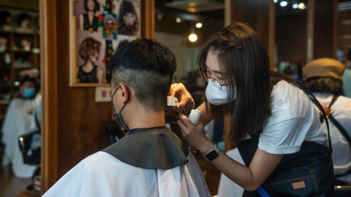 A student takes part in a hairdressing course in Hong Kong on August 27, 2022.