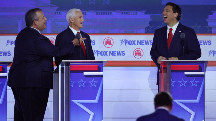 Candidates laugh during the first Republican candidates' debate of the 2024 US presidential campaign in Milwaukee, Wisconsin, US, August 23, 2023.